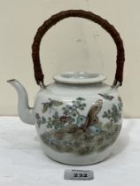A Chinese porcelain teapot and cover, decorated with foliage and flying insects to one side and