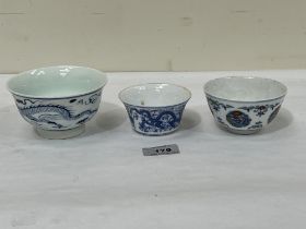 Three Chinese porcelain tea bowls. 4¼" diam and smaller.