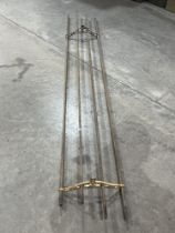A hanging clothes airer. 108" long