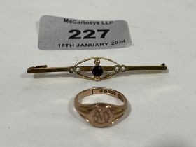 A 9ct signet ring, 3g and a gem set bar brooch apparently unmarked.