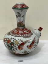 A Chinese wucai kendi , enamelled in colours with birds and foliage. 15" high.