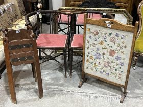 A pair of Edwardian corner chairs; an needlework fire screen; an oak jardiniere stand; an onyx
