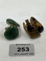 Two pairs of jade or tiger's eye cufflinks of free form.