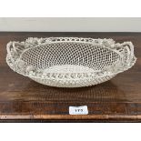 A Belleek oval basket, first period (1865-1899); the three-strand basket of twin handled form,