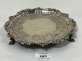 A George III Irish silver waiter, with cast rim and chased decoration of scrolled foliage. Dublin,