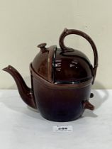 A 19th Century Wedgwood treacle glazed teapot. 7½" high.