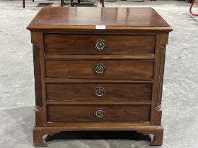 A small mahogany low chest of four drawers. 23" wide