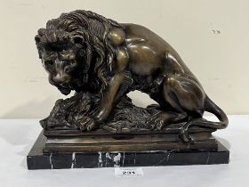 An animalier bronze lion and boar group, raised on a marble base. 11" wide.