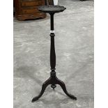 A 19th Century mahogany jardiniere stand with piecrust top in tripod support. 35" high.