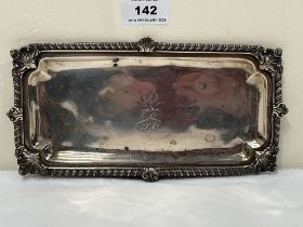 A George III silver gadrooned tray. Engraved with a lion rampant and monogram. London 1809. 9" wide.