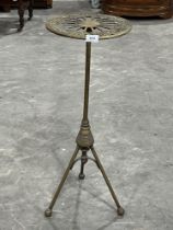 A 19th Century brass stand on tripod support. 30" high.