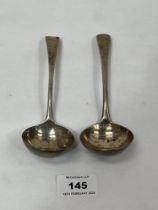 A pair of George III silver sauce ladles. Marks poorly struck. 7" long. 3 ozs 2 dwts