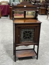 A Victorian mahogany side cabinet with mirrored superstructure, enclosed by a stained glass panel