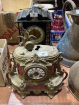 A 19th Century black slate mantle clock and another in gilt speltar (AF).