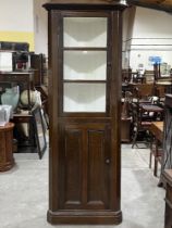 A 19th Century decorated standing corner cupboard. 89" high.