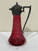 A Victorian cranberry glass and pewter mounted claret jug, wheel engraved with ferns and stars. 11½"