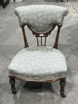 A Victorian walnut nursing chair