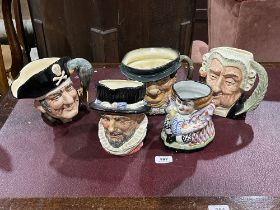 Four large Royal Doulton character jugs and a 19th Century Staffordshire Toby jug.