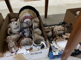 Three boxes of ceramics.