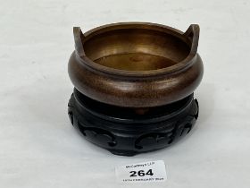 A Chinese bronze bowl on stand. 4" wide.
