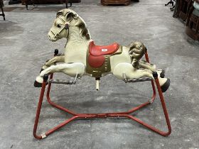 A Mobo Prairie King tinplate horse toy on spring frame. c. 1955.