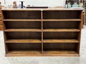 An early 20th Century oak open bookcase, the sides panelled. 72"w x 45"h