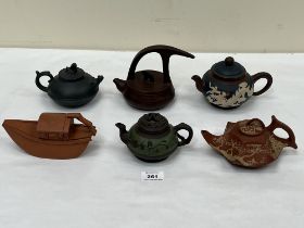 Six Chinese ceramic teapots.