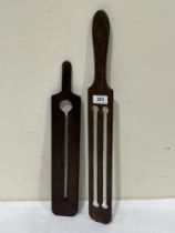 Two 19th Century treen button polish guards. 22" long and smaller.