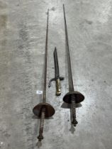Two fencing foils and a bayonet.