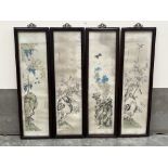 JAPANESE SCHOOL. LATE 19TH CENTURY A set of four textile pictures of prunus on rocky outcrops. The