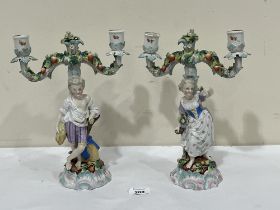 A pair of 19th Century Dresden porcelain two light figural candelabra. 11" high