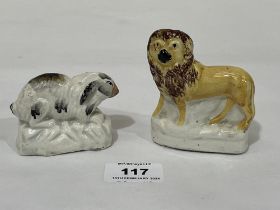 Two small 19th Century Staffordshire figures of a lion and rabbit. The lion 3¼" high