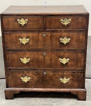 A George II walnut chest, the crossbanded top over two short and three long graduated line inlaid