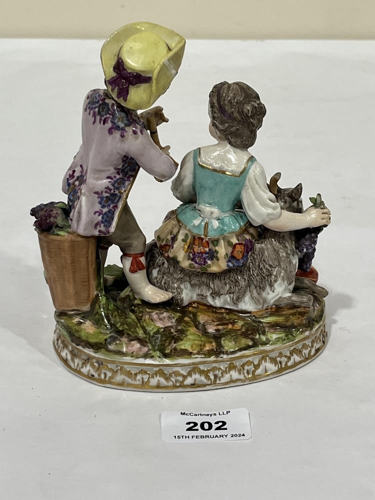 A 19th Century Dresden porcelain group allegorical of autumn, of a boy and girl in bright attire, - Image 2 of 3