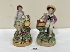 A pair of 19th Century Staffordshire figures, seated boy with monkey and female companion. 7¼"