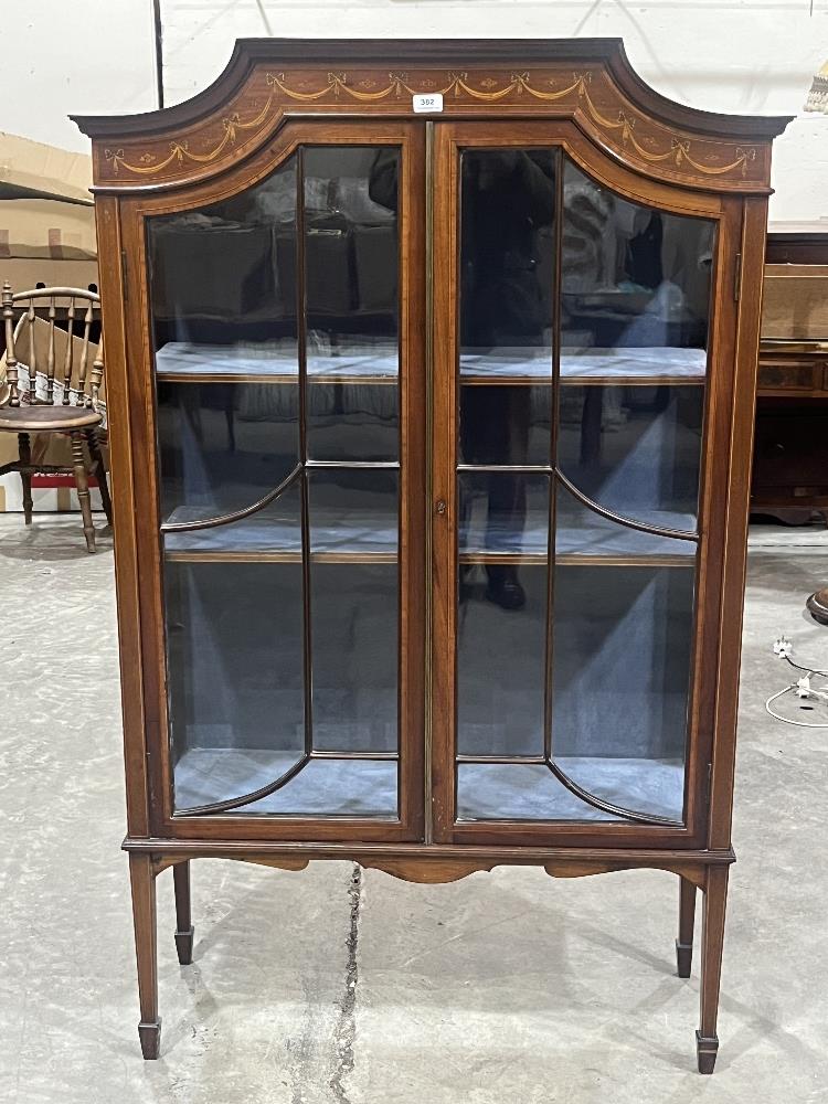 An Edward VII mahogany inlaid and crossbanded display cabinet, enclosed by a pair of astragal glazed