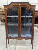 An Edward VII mahogany inlaid and crossbanded display cabinet, enclosed by a pair of astragal glazed