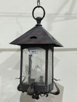 A 19th Century Arts and Crafts brass hall lantern. 17" high. One glass pane lacking.