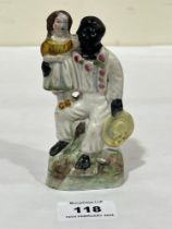 A 19th Century Staffordshire group of Uncle Tom and Little Eva. 5" high