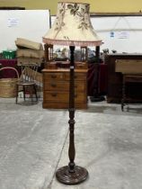 A mahogany reeded lamp standard