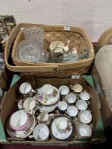 A box of ceramics and a basket of glassware.