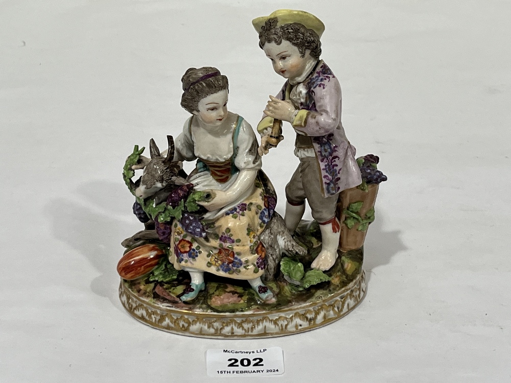 A 19th Century Dresden porcelain group allegorical of autumn, of a boy and girl in bright attire,