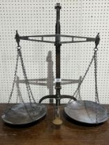 A Victorian set of brass scales by J. Hare, Birmingham. 24½" high.