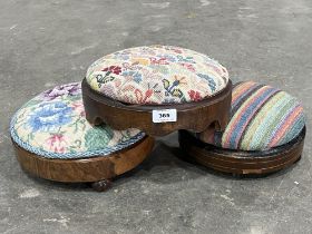Three Victorian walnut and upholstered footstools