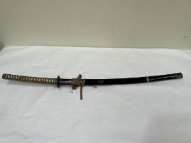 A Samurai style decorative sword. 45" long. Of recent manufacture.