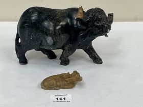 A hardstone carved ox, 7½" long and a small carved jade recumbent animal. Both with losses.