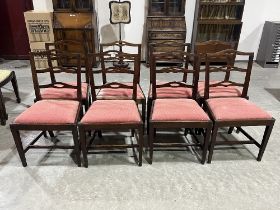 A 19th Century set of eight mahogany dining chairs with pierced ladder backs, on square tapered