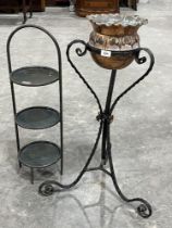 A copper jardiniere on wrought iron base and a three tier metal cake stand.