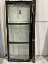 Three Victorian mahogany glazed shop display cupboard doors with rails.