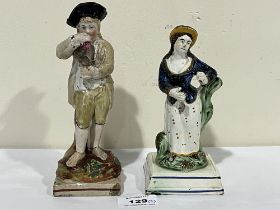 Two 19th Century Staffordshire pearlware figures, the larger 7½" high. Both damaged.